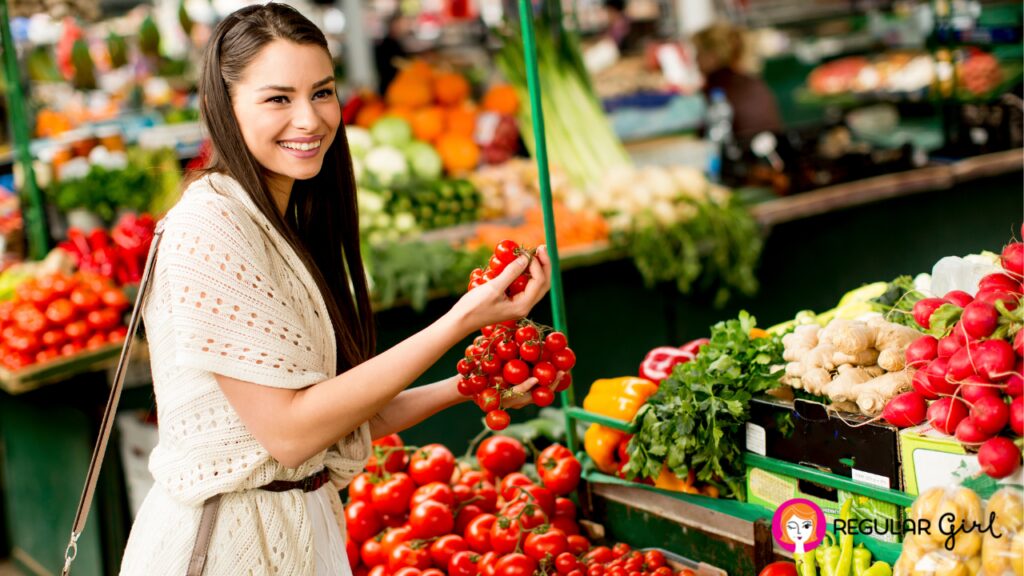 Woman holding tomatoes at farmers market